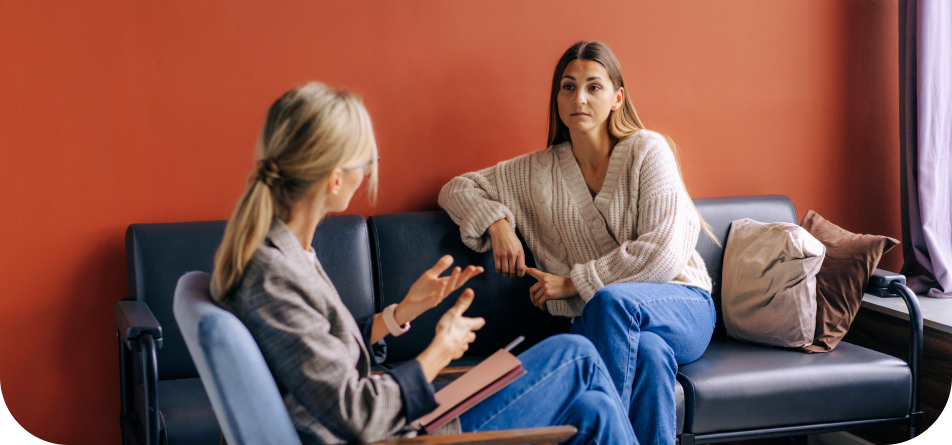 a female psychologist with a woman talking
